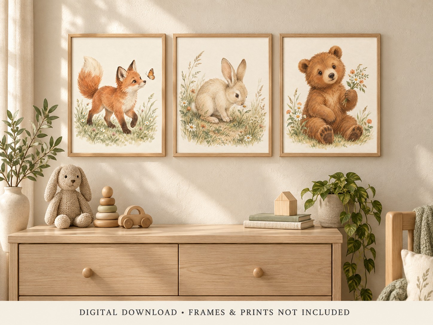 Styling illustration of the three woodland designs in frames above a wooden dresser